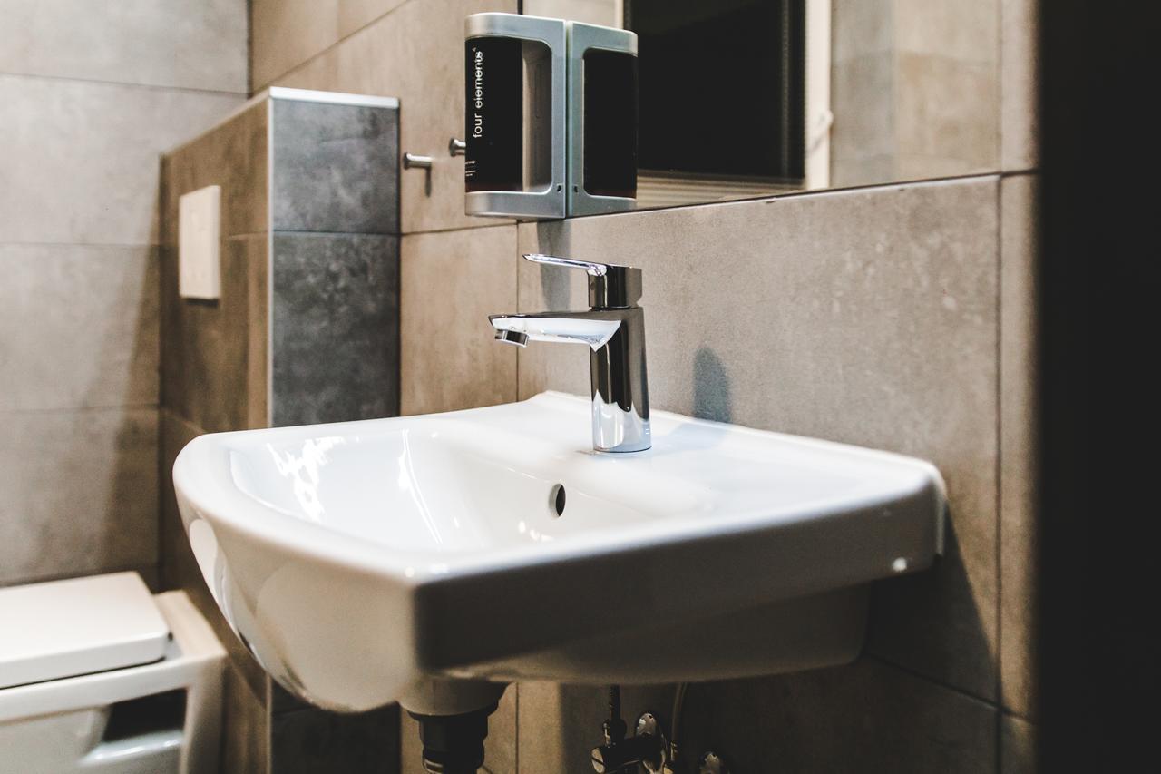 Silesia Residence Острава Экстерьер фото A soap dispenser mounted above a sink